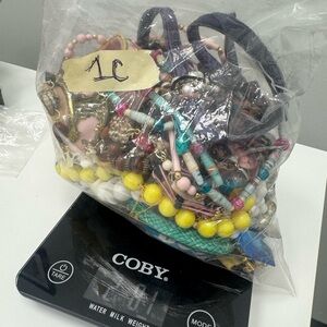 Bag of broken and tangled estate sale jewelry